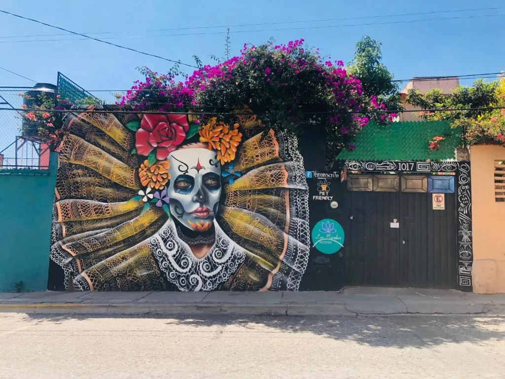 Catrina mural on the front wall of Los Nardos Hostel, Jalatlaco neighbourhood
